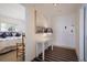 Light and airy entryway with a white console table and access to bedroom at 6925 Gulf Of Mexico Dr # 24, Longboat Key, FL 34228