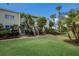 Well-maintained condo building with lush landscaping at 6925 Gulf Of Mexico Dr # 24, Longboat Key, FL 34228