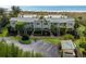 Ground level view of condo building with parking at 6925 Gulf Of Mexico Dr # 24, Longboat Key, FL 34228