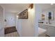 Modern kitchen with white cabinets and a breakfast bar at 6925 Gulf Of Mexico Dr # 24, Longboat Key, FL 34228