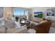 Spacious living room, coastal decor, and ocean views at 6925 Gulf Of Mexico Dr # 24, Longboat Key, FL 34228