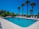 Refreshing community pool with lounge chairs at 6925 Gulf Of Mexico Dr # 24, Longboat Key, FL 34228