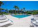 Inviting community pool surrounded by lush landscaping at 6925 Gulf Of Mexico Dr # 24, Longboat Key, FL 34228