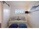 Bright sitting room with comfy couch and coastal decor at 6925 Gulf Of Mexico Dr # 24, Longboat Key, FL 34228
