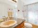Bathroom with granite countertop and shower/tub combo at 709 Barcelona Ave # D & E, Venice, FL 34285
