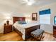 Main bedroom with wood flooring and beach themed decor at 709 Barcelona Ave # D & E, Venice, FL 34285
