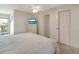 Spacious bedroom with a dresser, TV and large bed at 709 Barcelona Ave # D & E, Venice, FL 34285