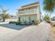 Front view of a two-story house with small patio at 709 Barcelona Ave # D & E, Venice, FL 34285
