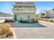 Two-story house, front view, small patio and garden at 709 Barcelona Ave # D & E, Venice, FL 34285