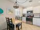 Kitchen with white cabinets and stainless steel appliances at 709 Barcelona Ave # D & E, Venice, FL 34285