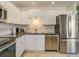 Kitchen with white cabinets and stainless steel appliances at 709 Barcelona Ave # D & E, Venice, FL 34285