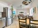 Open floor plan with stainless steel appliances and comfortable living area at 709 Barcelona Ave # D & E, Venice, FL 34285