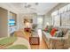 Living room features a sofa, armchairs, and a view at 709 Barcelona Ave # D & E, Venice, FL 34285