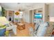 Bright living room with comfy seating, wood floors, and a dining area at 709 Barcelona Ave # D & E, Venice, FL 34285