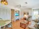 Open living area with dining table and comfortable seating at 709 Barcelona Ave # D & E, Venice, FL 34285