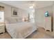 Main bedroom with king bed, dresser, and ceiling fan at 709 Barcelona Ave # D & E, Venice, FL 34285