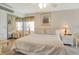 Spacious main bedroom with king-size bed and ceiling fan at 709 Barcelona Ave # D & E, Venice, FL 34285