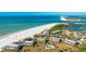 Aerial view of condo community near beach, showcasing beach and pool at 7155 Gulf Of Mexico Dr # 22, Longboat Key, FL 34228