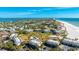 Aerial view showing community pool and beach access at 7155 Gulf Of Mexico Dr # 22, Longboat Key, FL 34228