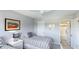 Guest bedroom with two twin beds and access to bathroom at 7155 Gulf Of Mexico Dr # 22, Longboat Key, FL 34228