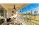 Enjoyable screened balcony with seating area overlooking pool and lawn at 7155 Gulf Of Mexico Dr # 22, Longboat Key, FL 34228