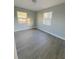Bright bedroom with wood-look flooring and neutral walls at 739 52Nd N Ave, St Petersburg, FL 33703