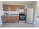Renovated kitchen with modern appliances and wood cabinets at 739 52Nd N Ave, St Petersburg, FL 33703