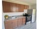 Renovated kitchen with modern appliances and wood cabinets at 739 52Nd N Ave, St Petersburg, FL 33703