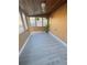 Cozy sunroom with wood-paneled walls and wood-look floors at 739 52Nd N Ave, St Petersburg, FL 33703