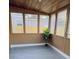 Bright sunroom with wood-look floors and multiple windows at 739 52Nd N Ave, St Petersburg, FL 33703