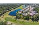 Aerial view showcasing a house near golf course at 770 Egret Walk Ln, Venice, FL 34292