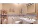 Charming bathroom with coastal decor and updated sink at 770 Egret Walk Ln, Venice, FL 34292