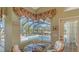 Cozy breakfast nook with pool view, perfect for morning coffee at 770 Egret Walk Ln, Venice, FL 34292