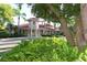 Community clubhouse with inviting entryway and landscaping at 770 Egret Walk Ln, Venice, FL 34292
