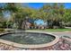 Community fountain with lush landscaping at 770 Egret Walk Ln, Venice, FL 34292