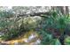 Calm creek flowing through a verdant landscape with tropical vegetation at 770 Egret Walk Ln, Venice, FL 34292