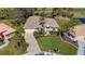 Home with two palm trees and a three-car garage at 770 Egret Walk Ln, Venice, FL 34292