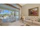 Bright Gathering room with pool view, comfy seating, and large windows at 770 Egret Walk Ln, Venice, FL 34292