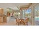 Kitchen with breakfast nook and view of the pool area at 770 Egret Walk Ln, Venice, FL 34292