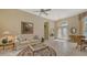 Spacious living room with tiled floors and access to foyer at 770 Egret Walk Ln, Venice, FL 34292