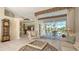 Living room with a view of the pool and patio, showcasing comfortable seating at 770 Egret Walk Ln, Venice, FL 34292