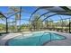 Relaxing screened pool and spa with patio area at 770 Egret Walk Ln, Venice, FL 34292