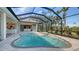 Inviting pool area with spa and screened enclosure at 770 Egret Walk Ln, Venice, FL 34292