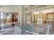 Patio with a table and chairs, offering a view of the pool and interior living space at 770 Egret Walk Ln, Venice, FL 34292