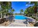 Resort-style pool with lounge chairs and lush landscaping at 770 Egret Walk Ln, Venice, FL 34292