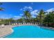 Large resort-style pool with plenty of lounge chairs at 770 Egret Walk Ln, Venice, FL 34292