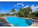 Resort-style pool with lounge chairs and a fountain at 770 Egret Walk Ln, Venice, FL 34292