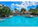 Resort-style pool with a stone fountain feature at 770 Egret Walk Ln, Venice, FL 34292