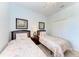 Bedroom with two twin beds and window at 8105 Grand Estuary Trl # 403, Bradenton, FL 34212