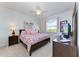 Main bedroom with king-size bed and plenty of natural light at 8105 Grand Estuary Trl # 403, Bradenton, FL 34212